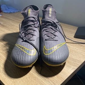 Size 10.5 yellow and grey Nike soccer cleats. New/unused without box.